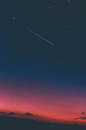 Evening sky with shooting star.