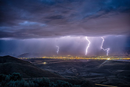 Hill landscape with lightning storm.